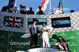 Race winner Valtteri Bottas (FIN) Mercedes AMG F1 with Mark Webber (AUS) Channel 4 Presenter on the podium. 17.03.2019. Formula 1 World Championship, Rd 1, Australian Grand Prix, Albert Park, Melbourne, Australia, Race Day.