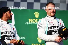 (L to R): Lewis Hamilton (GBR) Mercedes AMG F1 on the podium with race winner Valtteri Bottas (FIN) Mercedes AMG F1. 17.03.2019. Formula 1 World Championship, Rd 1, Australian Grand Prix, Albert Park, Melbourne, Australia, Race Day.