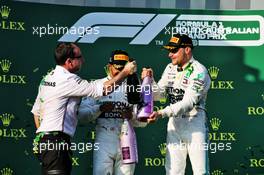 Race winner Valtteri Bottas (FIN) Mercedes AMG F1 celebrates on the podium with Lewis Hamilton (GBR) Mercedes AMG F1. 17.03.2019. Formula 1 World Championship, Rd 1, Australian Grand Prix, Albert Park, Melbourne, Australia, Race Day.