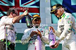 (L to R): Lewis Hamilton (GBR) Mercedes AMG F1 celebrates on the podium with race winner Valtteri Bottas (FIN) Mercedes AMG F1. 17.03.2019. Formula 1 World Championship, Rd 1, Australian Grand Prix, Albert Park, Melbourne, Australia, Race Day.