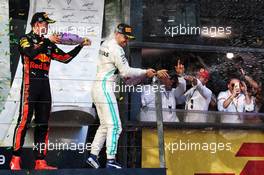 Race winner Valtteri Bottas (FIN) Mercedes AMG F1 celebrates on the podium with third placed Max Verstappen (NLD) Red Bull Racing. 17.03.2019. Formula 1 World Championship, Rd 1, Australian Grand Prix, Albert Park, Melbourne, Australia, Race Day.