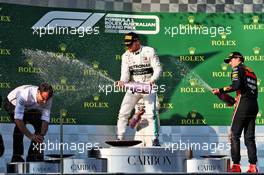 Race winner Valtteri Bottas (FIN) Mercedes AMG F1 celebrates on the podium with third placed Max Verstappen (NLD) Red Bull Racing. 17.03.2019. Formula 1 World Championship, Rd 1, Australian Grand Prix, Albert Park, Melbourne, Australia, Race Day.