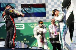 (L to R): Max Verstappen (NLD) Red Bull Racing celebrates on the podium with Lewis Hamilton (GBR) Mercedes AMG F1 and race winner Valtteri Bottas (FIN) Mercedes AMG F1. 17.03.2019. Formula 1 World Championship, Rd 1, Australian Grand Prix, Albert Park, Melbourne, Australia, Race Day.