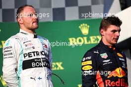 (L to R): Race winner Valtteri Bottas (FIN) Mercedes AMG F1 on the podium with Max Verstappen (NLD) Red Bull Racing. 17.03.2019. Formula 1 World Championship, Rd 1, Australian Grand Prix, Albert Park, Melbourne, Australia, Race Day.