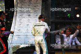 Race winner Valtteri Bottas (FIN) Mercedes AMG F1 celebrates on the podium with Max Verstappen (NLD) Red Bull Racing. 17.03.2019. Formula 1 World Championship, Rd 1, Australian Grand Prix, Albert Park, Melbourne, Australia, Race Day.