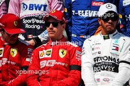 (L to R): Charles Leclerc (MON) Ferrari; Sebastian Vettel (GER) Ferrari; and Lewis Hamilton (GBR) Mercedes AMG F1, at the start of season group photograph. 17.03.2019. Formula 1 World Championship, Rd 1, Australian Grand Prix, Albert Park, Melbourne, Australia, Race Day.