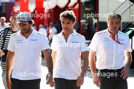 (L to R): Carlos Sainz Jr (ESP) McLaren with Lando Norris (GBR) McLaren and Paul James (GBR) McLaren Team Manager. 28.06.2019. Formula 1 World Championship, Rd 9, Austrian Grand Prix, Spielberg, Austria, Practice Day.