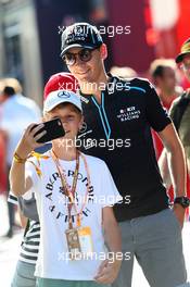 George Russell (GBR) Williams Racing with a young fan. 28.06.2019. Formula 1 World Championship, Rd 9, Austrian Grand Prix, Spielberg, Austria, Practice Day.