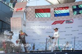 The podium (L to R): race winner Max Verstappen (NLD) Red Bull Racing celebrates with third placed Valtteri Bottas (FIN) Mercedes AMG F1. 30.06.2019 Formula 1 World Championship, Rd 9, Austrian Grand Prix, Spielberg, Austria, Race Day.
