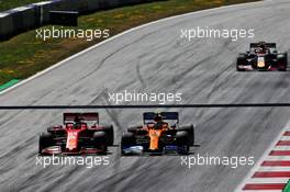 (L to R): Sebastian Vettel (GER) Ferrari SF90 and Lando Norris (GBR) McLaren MCL34 battle for position. 30.06.2019 Formula 1 World Championship, Rd 9, Austrian Grand Prix, Spielberg, Austria, Race Day.