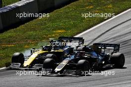 Nico Hulkenberg (GER) Renault F1 Team RS19 and Kevin Magnussen (DEN) Haas VF-19 battle for position. 30.06.2019 Formula 1 World Championship, Rd 9, Austrian Grand Prix, Spielberg, Austria, Race Day.