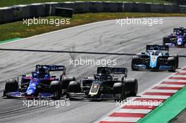 (L to R): Alexander Albon (THA) Scuderia Toro Rosso STR14 with Romain Grosjean (FRA) Haas F1 Team VF-19. 30.06.2019 Formula 1 World Championship, Rd 9, Austrian Grand Prix, Spielberg, Austria, Race Day.