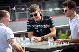 George Russell (GBR) Williams Racing with Lando Norris (GBR) McLaren and Billy Monger (GBR) Racing Driver. 27.06.2019. Formula 1 World Championship, Rd 9, Austrian Grand Prix, Spielberg, Austria, Preparation Day.