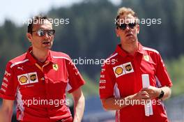 Sebastian Vettel (GER) Ferrari walks the circuit with Riccardo Adami (ITA) Ferrari Race Engineer. 27.06.2019. Formula 1 World Championship, Rd 9, Austrian Grand Prix, Spielberg, Austria, Preparation Day.