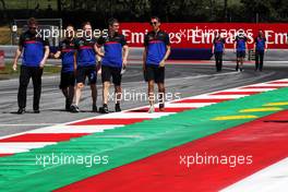 Alexander Albon (THA) Scuderia Toro Rosso walks the circuit with the team. 27.06.2019. Formula 1 World Championship, Rd 9, Austrian Grand Prix, Spielberg, Austria, Preparation Day.