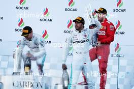 (L to R): Race winner Valtteri Bottas (FIN) Mercedes AMG F1 on the podium with Lewis Hamilton (GBR) Mercedes AMG F1 and Sebastian Vettel (GER) Ferrari.  28.04.2019. Formula 1 World Championship, Rd 4, Azerbaijan Grand Prix, Baku Street Circuit, Azerbaijan, Race Day.