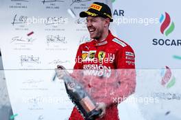 Sebastian Vettel (GER) Ferrari celebrates his third position on the podium. 28.04.2019. Formula 1 World Championship, Rd 4, Azerbaijan Grand Prix, Baku Street Circuit, Azerbaijan, Race Day.