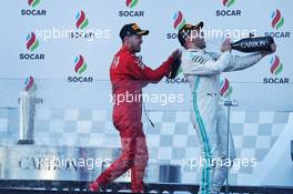 Race winner Valtteri Bottas (FIN) Mercedes AMG F1 celebrates on the podium with third placed Sebastian Vettel (GER) Ferrari. 28.04.2019. Formula 1 World Championship, Rd 4, Azerbaijan Grand Prix, Baku Street Circuit, Azerbaijan, Race Day.