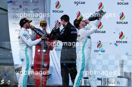 (L to R): Lewis Hamilton (GBR) Mercedes AMG F1 celebrates on the podium with Sebastian Vettel (GER) Ferrari and race winner Valtteri Bottas (FIN) Mercedes AMG F1. 28.04.2019. Formula 1 World Championship, Rd 4, Azerbaijan Grand Prix, Baku Street Circuit, Azerbaijan, Race Day.