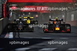Kevin Magnussen (DEN) Haas VF-19 and Pierre Gasly (FRA) Red Bull Racing RB15 battle for position. 28.04.2019. Formula 1 World Championship, Rd 4, Azerbaijan Grand Prix, Baku Street Circuit, Azerbaijan, Race Day.