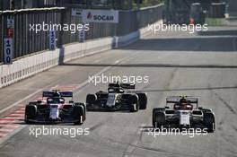 Alexander Albon (THA) Scuderia Toro Rosso STR14 and Antonio Giovinazzi (ITA) Alfa Romeo Racing C38 battle for position. 28.04.2019. Formula 1 World Championship, Rd 4, Azerbaijan Grand Prix, Baku Street Circuit, Azerbaijan, Race Day.