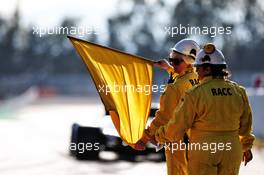 Marshals with a yellow flag. 18.02.2019. Formula One Testing, Day One, Barcelona, Spain. Monday.