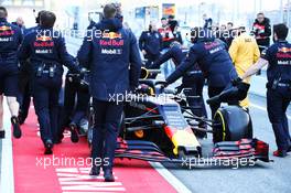 Max Verstappen (NLD) Red Bull Racing RB14 pushed back in the pit lane. 18.02.2019. Formula One Testing, Day One, Barcelona, Spain. Monday.