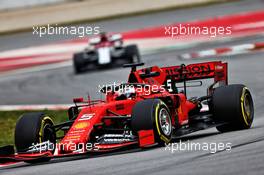 Sebastian Vettel (GER) Ferrari SF90 leads Kimi Raikkonen (FIN) Alfa Romeo Racing C38. 20.02.2019. Formula One Testing, Day Three, Barcelona, Spain. Wednesday.
