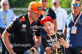 Max Verstappen (NLD) Red Bull Racing with a young fan. 30.08.2019. Formula 1 World Championship, Rd 13, Belgian Grand Prix, Spa Francorchamps, Belgium, Practice Day.