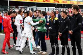 Lewis Hamilton (GBR) Mercedes AMG F1 and the grid pays its respects to Anthoine Hubert with his family. 01.09.2019. Formula 1 World Championship, Rd 13, Belgian Grand Prix, Spa Francorchamps, Belgium, Race Day.