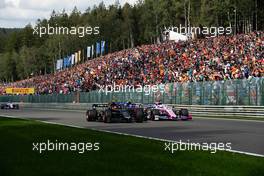 Kevin Magnussen (DEN) Haas VF-19 and Sergio Perez (MEX) Racing Point F1 Team RP19 at the start of the race. 01.09.2019. Formula 1 World Championship, Rd 13, Belgian Grand Prix, Spa Francorchamps, Belgium, Race Day.