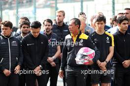 F1, F2, and F3 pay their respects to Anthoine Hubert: Guanyu Zhou (CHN) Renault F1 Team Test and Development Driver; Mia Sharizman (MAL) Renault Sport Academy Director; Jack Aitken (GBR) / (KOR) Renault F1 Team Test Driver. 01.09.2019. Formula 1 World Championship, Rd 13, Belgian Grand Prix, Spa Francorchamps, Belgium, Race Day.