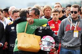 F1, F2, and F3 pay their respects to Anthoine Hubert: Mia Sharizman (MAL) Renault Sport Academy Director with his mother. 01.09.2019. Formula 1 World Championship, Rd 13, Belgian Grand Prix, Spa Francorchamps, Belgium, Race Day.