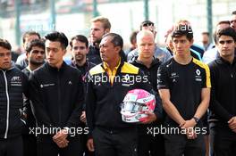 F1, F2, and F3 pay their respects to Anthoine Hubert: Guanyu Zhou (CHN) Renault F1 Team Test and Development Driver; Mia Sharizman (MAL) Renault Sport Academy Director; Jack Aitken (GBR) / (KOR) Renault F1 Team Test Driver. 01.09.2019. Formula 1 World Championship, Rd 13, Belgian Grand Prix, Spa Francorchamps, Belgium, Race Day.