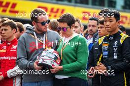 F1, F2, and F3 pay their respects to Anthoine Hubert with his family. 01.09.2019. Formula 1 World Championship, Rd 13, Belgian Grand Prix, Spa Francorchamps, Belgium, Race Day.