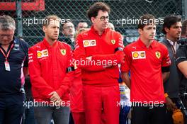 F1, F2, and F3 pay their respects to Anthoine Hubert (L to R): Sebastian Vettel (GER) Ferrari; Mattia Binotto (ITA) Ferrari Team Principal; and Charles Leclerc (MON) Ferrari. 01.09.2019. Formula 1 World Championship, Rd 13, Belgian Grand Prix, Spa Francorchamps, Belgium, Race Day.