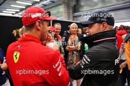 (L to R): Sebastian Vettel (GER) Ferrari and Valtteri Bottas (FIN) Mercedes AMG F1 on the drivers parade. 01.09.2019. Formula 1 World Championship, Rd 13, Belgian Grand Prix, Spa Francorchamps, Belgium, Race Day.