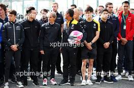 F1, F2, and F3 pay their respects to Anthoine Hubert: Alain Prost (FRA) Renault F1 Team Special Advisor; Guanyu Zhou (CHN) Renault F1 Team Test and Development Driver; Mia Sharizman (MAL) Renault Sport Academy Director; Jack Aitken (GBR) / (KOR) Renault F1 Team Test Driver. 01.09.2019. Formula 1 World Championship, Rd 13, Belgian Grand Prix, Spa Francorchamps, Belgium, Race Day.