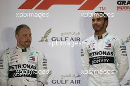 Valtteri Bottas (FIN) Mercedes AMG F1 and Lewis Hamilton (GBR) Mercedes AMG F1. 31.03.2019. Formula 1 World Championship, Rd 2, Bahrain Grand Prix, Sakhir, Bahrain, Race Day.