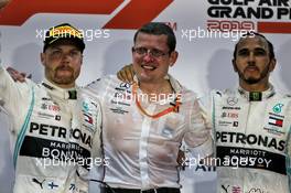 (L to R): Valtteri Bottas (FIN) Mercedes AMG F1 celebrates on the podium with Pitwall chief reliability engineer Simon Cole Mercedes AMG F1 and race winner Lewis Hamilton (GBR) Mercedes AMG F1. 31.03.2019. Formula 1 World Championship, Rd 2, Bahrain Grand Prix, Sakhir, Bahrain, Race Day.