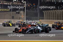 Valtteri Bottas (FIN) Mercedes AMG F1 W10 and Charles Leclerc (MON) Ferrari SF90 at the start of the race. 31.03.2019. Formula 1 World Championship, Rd 2, Bahrain Grand Prix, Sakhir, Bahrain, Race Day.