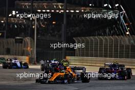 Lando Norris (GBR) McLaren MCL34 and Alexander Albon (THA) Scuderia Toro Rosso STR14 battle for position. 31.03.2019. Formula 1 World Championship, Rd 2, Bahrain Grand Prix, Sakhir, Bahrain, Race Day.