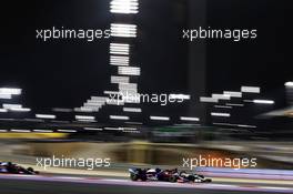 Daniil Kvyat (RUS) Scuderia Toro Rosso STR14 and Kimi Raikkonen (FIN) Alfa Romeo Racing C38. 31.03.2019. Formula 1 World Championship, Rd 2, Bahrain Grand Prix, Sakhir, Bahrain, Race Day.