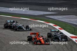 Charles Leclerc (MON) Ferrari SF90 and Valtteri Bottas (FIN) Mercedes AMG F1 W10 battle for position. 31.03.2019. Formula 1 World Championship, Rd 2, Bahrain Grand Prix, Sakhir, Bahrain, Race Day.