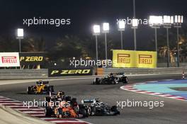 Charles Leclerc (MON) Ferrari SF90 and Lewis Hamilton (GBR) Mercedes AMG F1 W10 battle for position. 31.03.2019. Formula 1 World Championship, Rd 2, Bahrain Grand Prix, Sakhir, Bahrain, Race Day.
