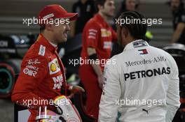 Sebastian Vettel (GER) Ferrari and Lewis Hamilton (GBR) Mercedes AMG F1. 30.03.2019. Formula 1 World Championship, Rd 2, Bahrain Grand Prix, Sakhir, Bahrain, Qualifying Day.
