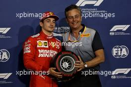 Charles Leclerc (MON) Ferrari receives the Pirelli Pole Position award from Mario Isola (ITA) Pirelli Racing Manager. 30.03.2019. Formula 1 World Championship, Rd 2, Bahrain Grand Prix, Sakhir, Bahrain, Qualifying Day.