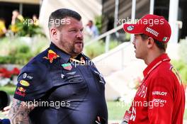(L to R): Nigel Hope (GBR) Red Bull Racing Senior Garage Technician with Sebastian Vettel (GER) Ferrari. 28.03.2019. Formula 1 World Championship, Rd 2, Bahrain Grand Prix, Sakhir, Bahrain, Preparation Day.