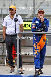(L to R): Carlos Sainz Jr (ESP) McLaren with Fernando Alonso (ESP) McLaren Test Driver. 02.04.2019. Formula One Testing, Sakhir, Bahrain, Tueday.