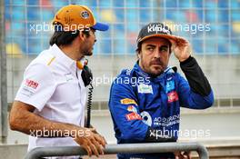 (L to R): Fernando Alonso (ESP) McLaren Test Driver with Carlos Sainz Jr (ESP) McLaren. 02.04.2019. Formula One Testing, Sakhir, Bahrain, Tueday.